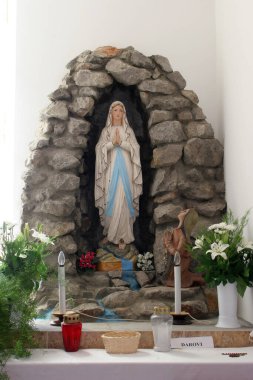 Our Lady of Lourdes, a statue in the pastoral center in the parish of St. Martin Bishop in Hrnetic, Karlovac, Croatia clipart