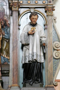 Aziz Aloysius, Hırvatistan 'ın Trnjani kentindeki Aziz Mark kilisesindeki Aziz Blaise mihrabında heykel.