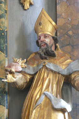 Hippo 'lu Aziz Augustine, Hırvatistan' ın Cazma kentindeki Aziz Meryem Kilisesi 'nde Meryem Ana' nın taç giyme töreninin sunağında heykel.