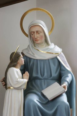 Saint Anne with Virgin Mary, statue in the Church of Visitation of the Virgin Mary in Sisak, Croatia clipart