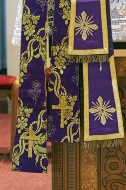 Purple Catholic Priest Stole in the church of Assumption of the Virgin Mary in Brodsko Vinogorje, Croatia clipart