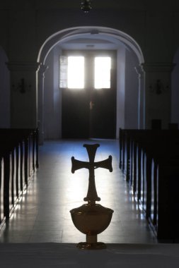 Cross on the main altar in the Cathedral of Holy Cross in Sisak, Croatia clipart