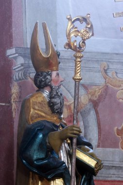 Aziz Ambrose, Hırvatistan 'ın Slavonski Brod kentindeki Fransisken Kutsal Üçlü Kilisesi' nin sunağında heykel.