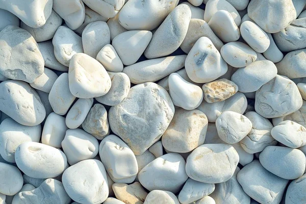 Close-up of white rounded river stones creating a serene and textured background.