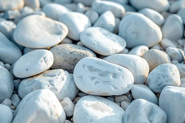 Close-up of white rounded river stones creating a serene and textured background.