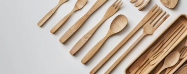 A clean and simple display of eco-friendly biodegradable cutlery on a white background. clipart