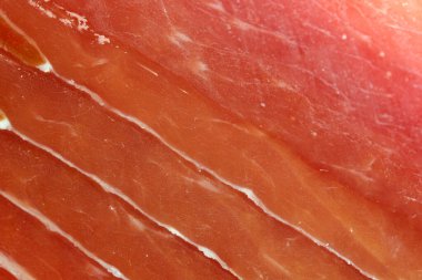 Et pazarı arka planı, jamon kesme, yakın çekim, makro fotoğraf.