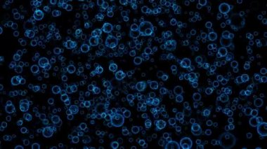 Karanlık sükunet içinde yüzen canlı mavi kabarcıkların büyüleyici hareketine tanık olun..