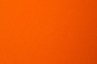 Parlak turuncu arka plan yaratıcılık için mükemmel bir enerji ortamı yaratır..