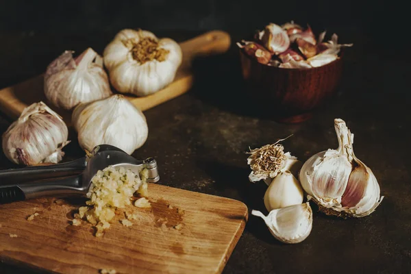 Garlic press with garlic cloves
