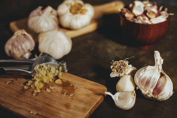 Garlic press with garlic cloves