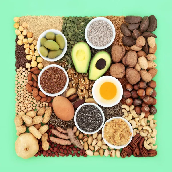 stock image Essential fatty acid foods high in healthy lipids. Ingredients contain unsaturated good fats for healthy heart and cholesterol levels with nuts, seeds, dairy, vegetables, legumes and grain.  