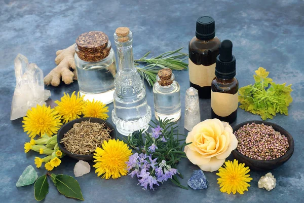 Crystal healing with herbs and flowers for naturopathic herbal plant medicine and flowers remedies. Wicca, pagan occult nature theme with essential oils for medicinal preparation.