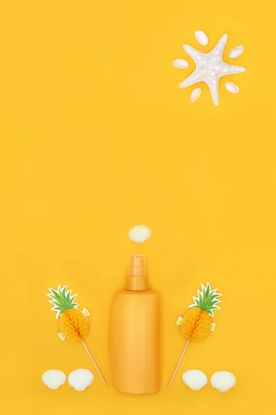 Suntan suntan lotion bottle for natural skincare protection with shells and starfish sun on yellow background. Abstract minimal design for the holiday season.
