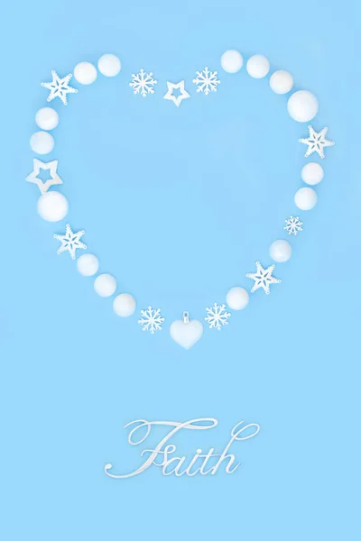 Christmas faith sign and heart shape wreath of white snowflakes, stars and balls. Symbol for holiday season on blue background. Festive greeting card, menu, invitation, logo.