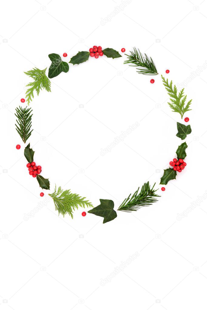 Traditional natural winter solstice nature flora wreath, holly, red berries, fir, ivy leaves on white. Festive minimal abstract design for Xmas holiday season.