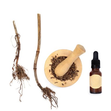 Kediotu kökü alternatif bitkisel ilaç üzerine beyaz harç, tentür şişesi. Uykusuzluk, stres, endişe, sindirim sağlığı, regl sancıları tedavisi. Doğal iyileşme.