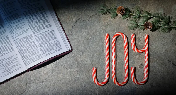 Open Bible Joy Written Candy Canes Stone Table — Stock Photo, Image