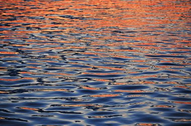 Closeup Colorful Abstract Sunrise Reflection On Danube River in Galati ,Romania