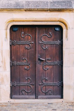 Wooden carved ancient door. The concept of history and culture