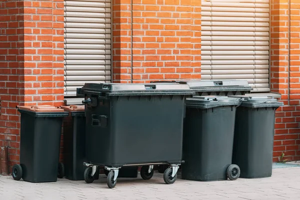 Stock image Group of new and clean garbage bins at city street. Trash and rubbish cans as environment and eco project