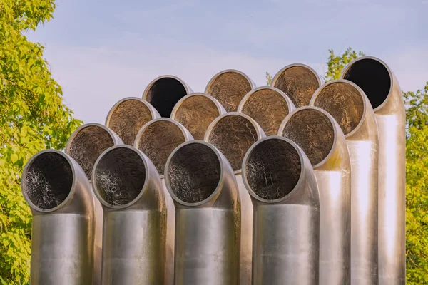 Group of industrial ventilation pipes outdoors. Air conditioning system and metal infrastructure