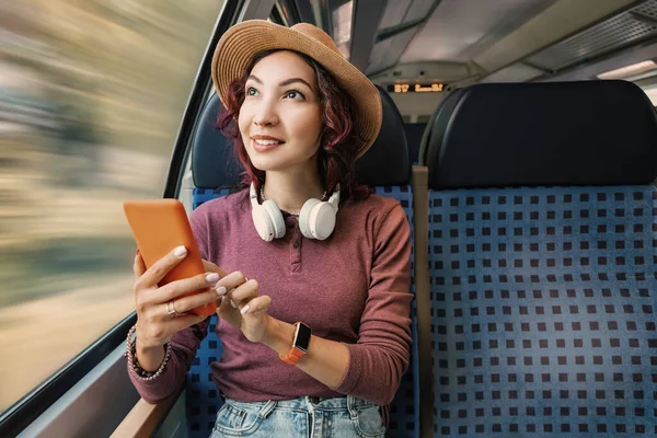 Girl Surfing Internet Her Mobile Phone While Traveling Train Headphones — Stock Photo, Image