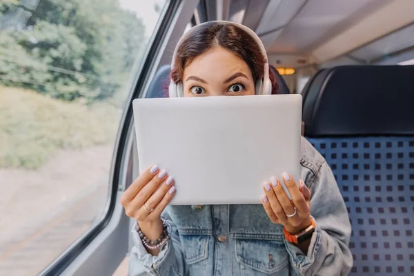 Girl Funny Emotion Hiding Her Laptop Notebook Train Ride Personal — Stock Photo, Image