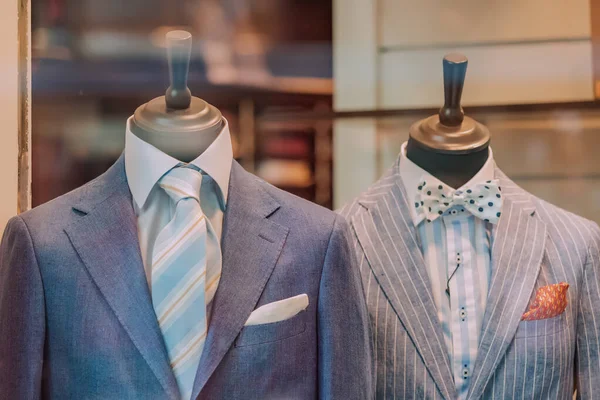 Vintage retro and stylish men suits on a mannequin in a clothing store or tailor
