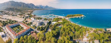 the essence of Kemer resort town, Turkey's coastal charm with our breathtaking aerial image showcasing its scenic landscapes and vibrant blue waters. clipart
