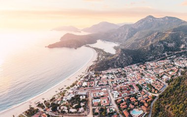Aerial view of a resort town Oludeniz in Turkiye at sunset. Travel landmarks and destinations