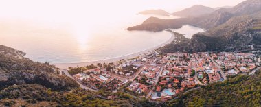 Aerial view of a resort town Oludeniz in Turkiye at sunset. Travel landmarks and destinations
