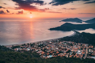 Aerial view of a resort town Oludeniz in Turkiye at sunset. Travel landmarks and destinations