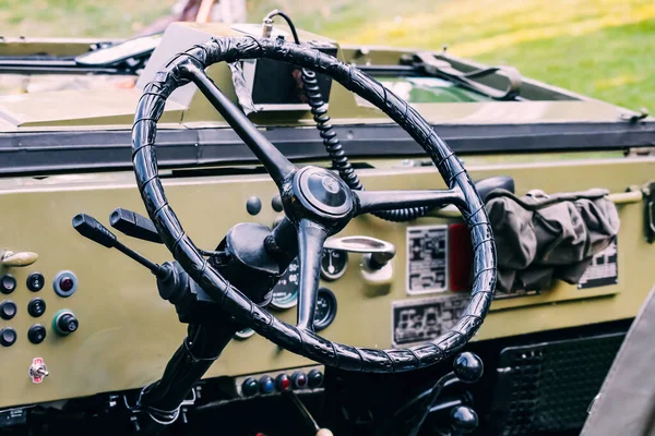 Vintage Auto Aesthetics: A retro dashboard in a classic military vehicle captures the essence of old-world charm and historic transportation.