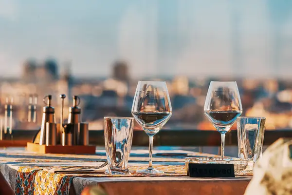 luxurious evening atop a rooftop restaurant, where the city skyline serves as a breathtaking backdrop to celebration.