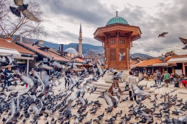15 March 2024, Sarajevo, Bosnia and Herzegovina: Sarajevo's lively Sebilj fountain square offers a glimpse into the city's bustling market scene and Islamic architecture. clipart