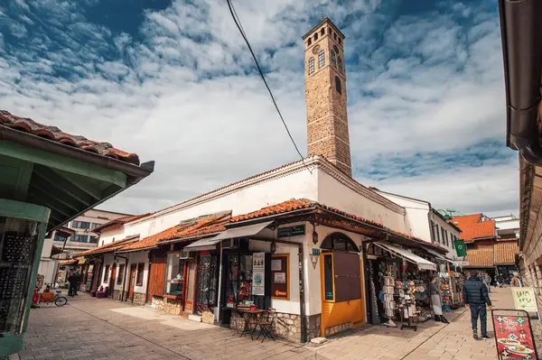 Stock image 15 March 2024, Sarajevo, Bosnia and Herzegovina: Iconic Sahat Tower rises majestically amidst Sarajevo's historic bazaar, a must-see attraction blending Ottoman charm with European allure.