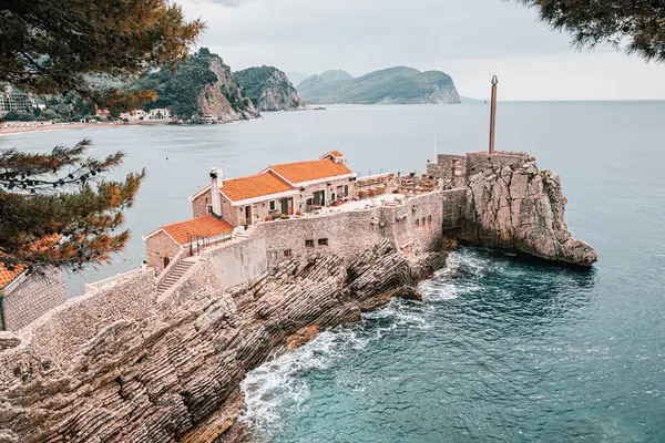 stock image Picturesque view of Petrovac, Montenegro, with its historic castle, Kastio, by the Adriatic Sea