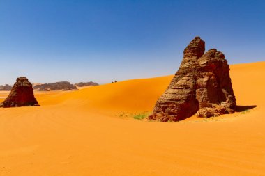 Big sand dunes and amazing rock towers of Tin Merzouga.   Tadrart mountains, Tassili n'Ajjer National Park, Algeria, Illizi,  Sahara, Afrika