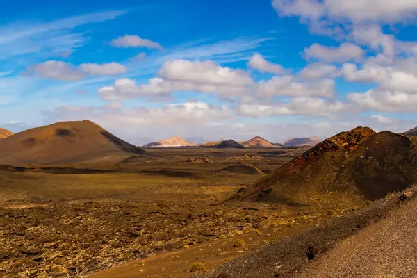 stock image Timanfaya National Park  also known as Fire Mountains ( Las Montaas del Fuego ). Volcanic ladscape with red craters , sea of lava and  the volcanic walls. Lanzarote, Canary Islands, Spain