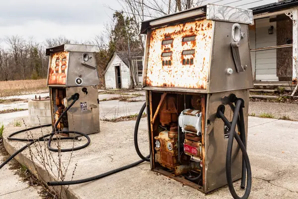 stock image Old broken fuel pumps at abandoned petrol station