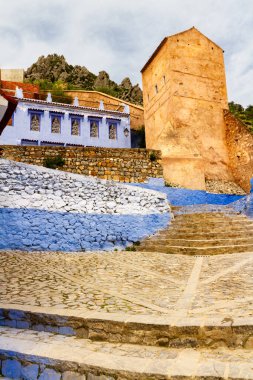 Chefchaouen, blue city. View on medieval stone city walls and the gate tower. Chefchaouen, Morocco, Africa clipart