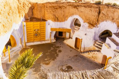 Courtyard of berber underground dwellings. Troglodyte house.  Original decoration of the movie Star Wars. Matmata, Tunisia clipart