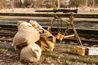 Historical reconstruction. German World War II infantry  position with Mg42 machine gun and ammunition boxes.   clipart