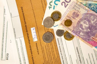 Close-up. Background. PIT-37. Polish tax return form for 2024 (called PIT) with money