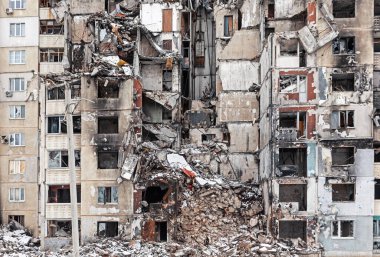 KHARKIV, UKRAINE - Mar. 02, 2023: The scars of war in Ukraine. Destroyed apartment building. Aftermath of a rocket attack, capturing the devastating impact of war in North Saltivka, Kharkiv.