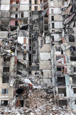 KHARKIV, UKRAINE - Mar. 02, 2023: The scars of war in Ukraine. Destroyed apartment building. Aftermath of a rocket attack, capturing the devastating impact of war in North Saltivka, Kharkiv. clipart