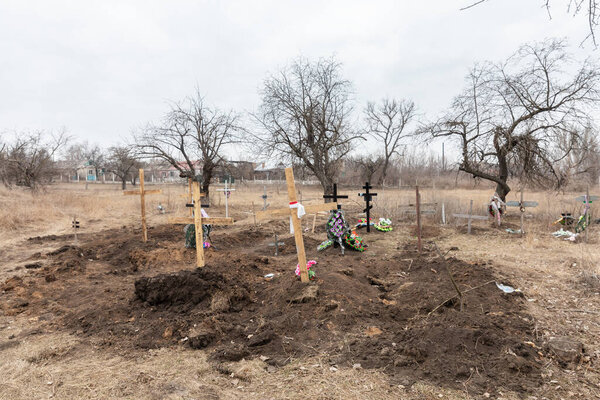 SIVERSK, DONETSK REG., UKRAINE - Mar. 10, 2024: Due to the constant shelling dead residents of Siversk are now buried right next to the hospital. There are already 20 graves here, 6 inlast two weeks