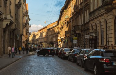 LVIV, UKRAINE - May. 18, 2024: Historic buildings in old town of Lviv. Lviv is the cultural capital of Ukraine and is a favorite destination for tourists from all over the world clipart