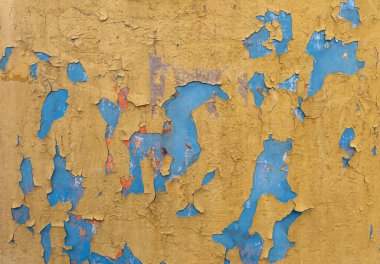 Bir binanın ön cephesinde eski bir alçı. Soyut arkaplan ve doku.